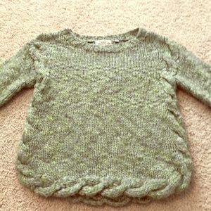 Green and blue sweater.